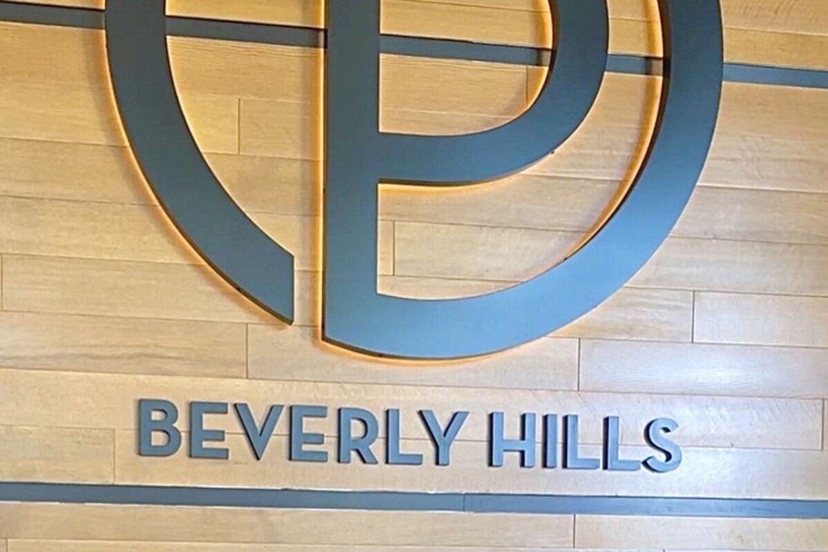 Receptionists%20below%20the%20logo%20sign%20at%20Ocean%20Prime%20Beverly%20Hills%20restaurant%2E