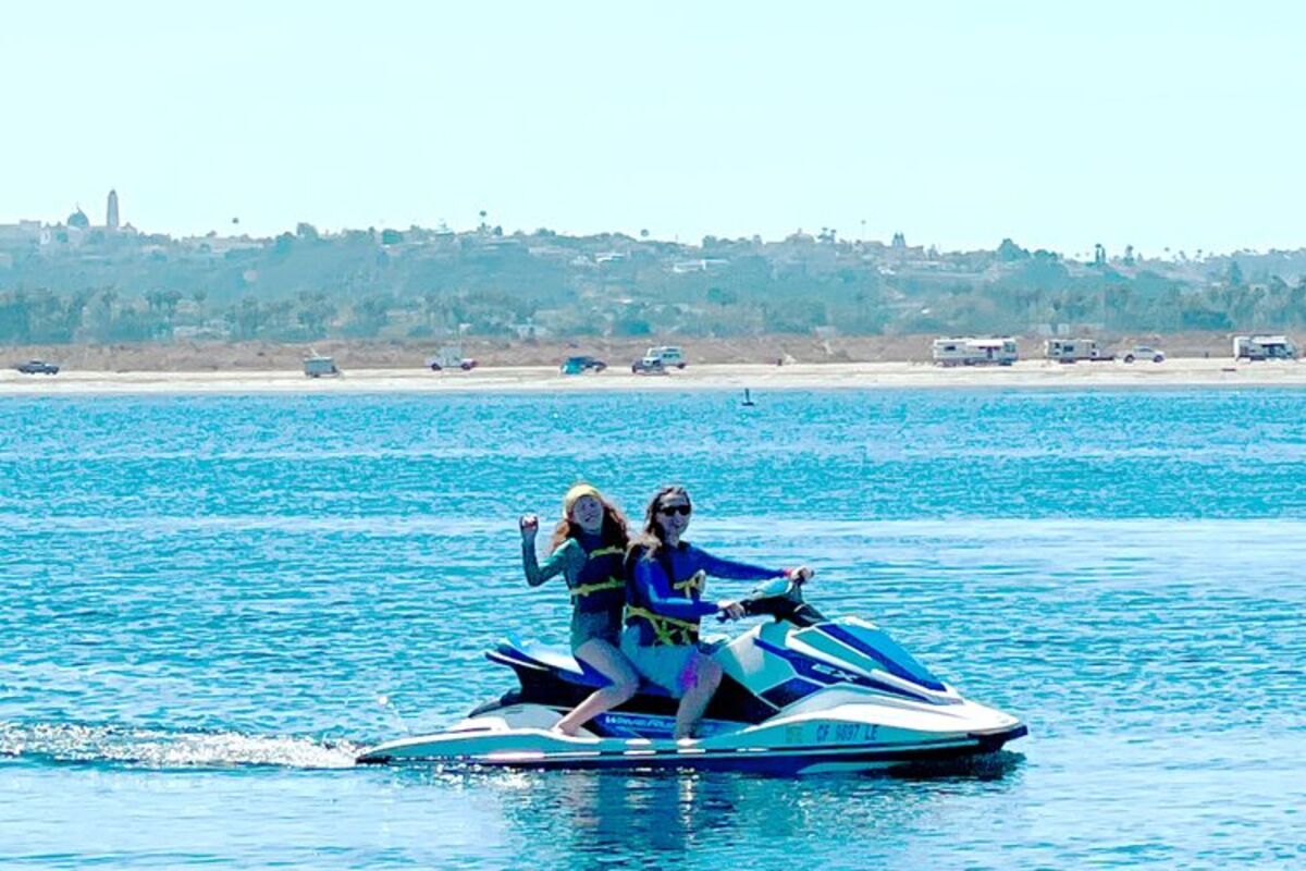 Two%20girls%20on%20a%20jet%20ski%20riding%20in%20the%20water%20at%20Campland%2E