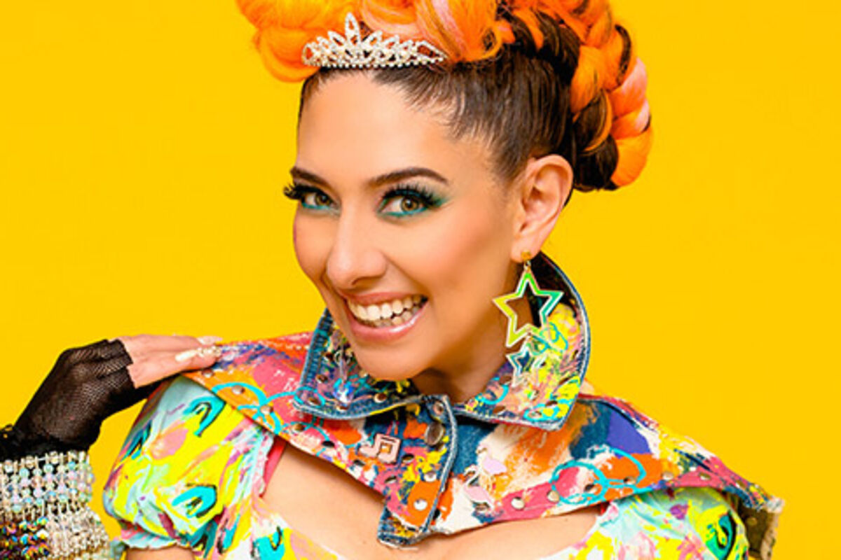 Woman%20with%20colorful%20dress%20on%20smiling%2E